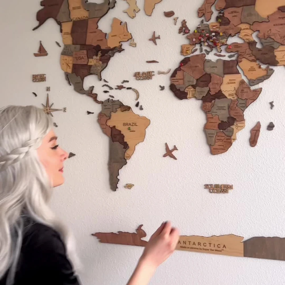 Hands unboxing a wooden gift